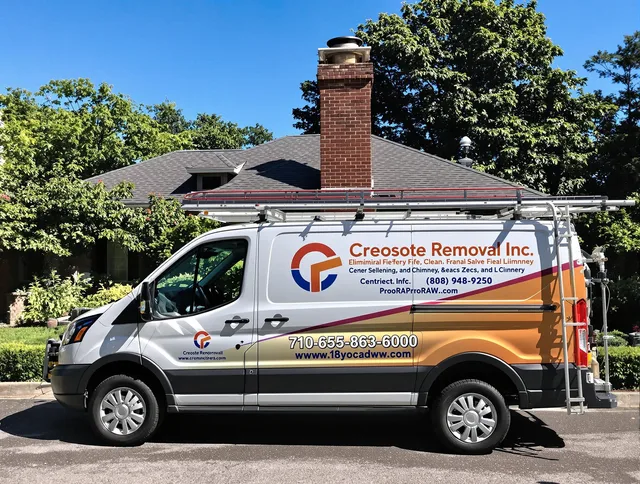 Millbury Chimney Sweep technician removing creosote safely in Millbury, MA