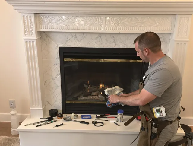 Millbury Chimney Sweep performing fireplace maintenance in Millbury, MA